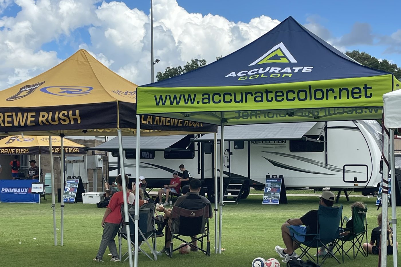 Accurate Color and LA Krewe Rush canopy tents at an outdoor tournament