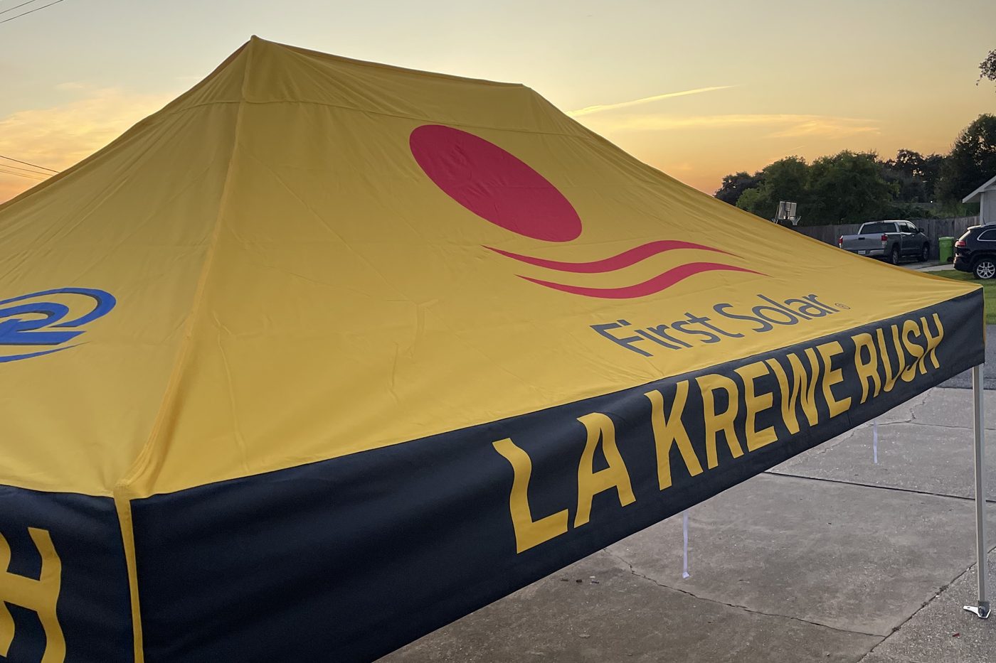 LA Krewe Rush and First Solar canopy tent at sunset